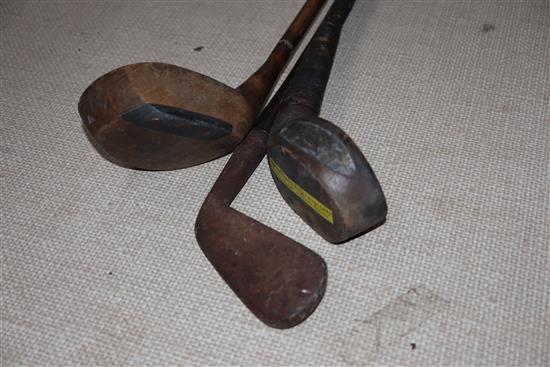 A D. Herd scared-neck bulger driver, c.1895, a L. Searle Elmstead GC hickory shafted driver and a hickory shafted iron